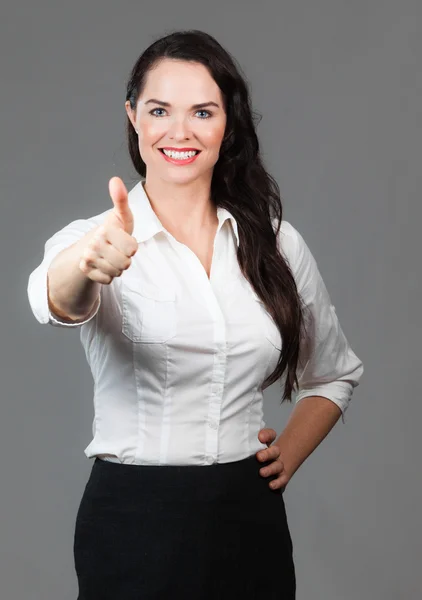 Business woman giving thumbs up — Stock Photo, Image