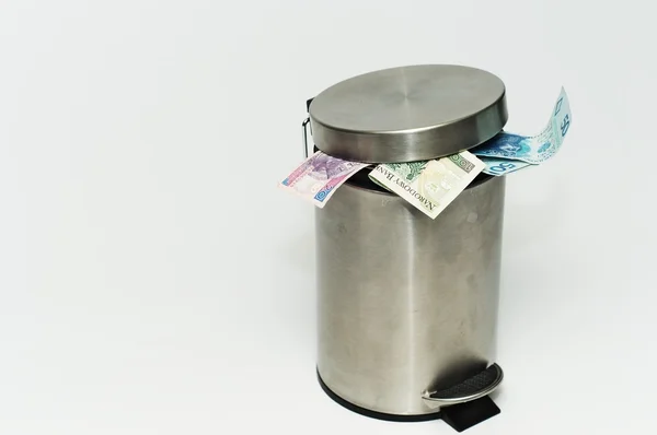 Banknotes sticking out of the trash — Stock Photo, Image