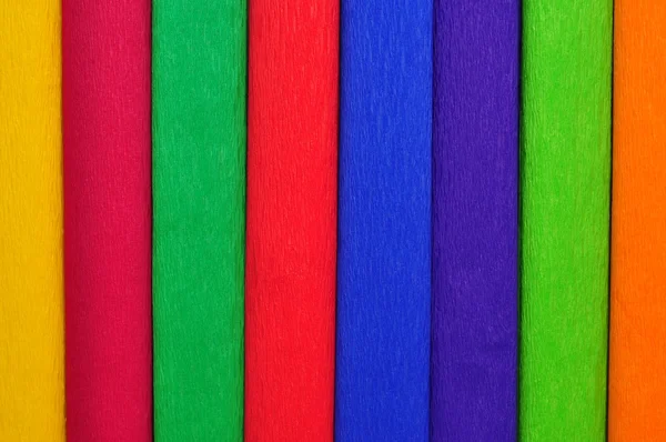 Hintergrund aus farbigen Seidenpapierrollen lizenzfreie Stockfotos
