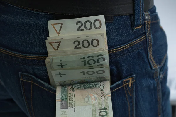 Bankotes sticking out of pocket — Stock Photo, Image