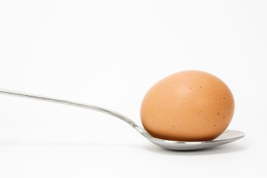 Spoon with an egg clipart