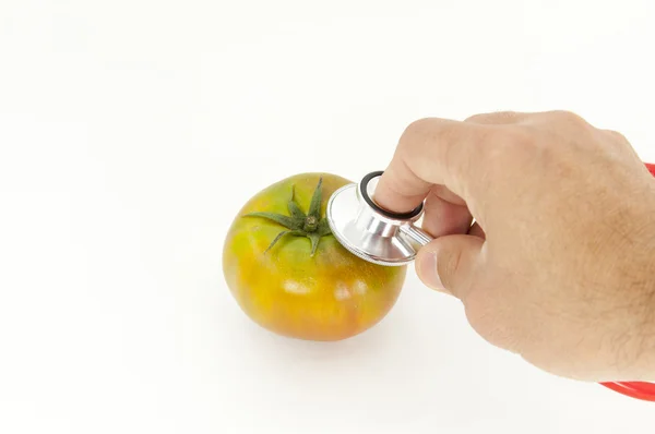 Escuchando un tomate —  Fotos de Stock