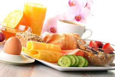 Breakfast with coffee, rolls, egg, orange juice, muesli and chee clipart