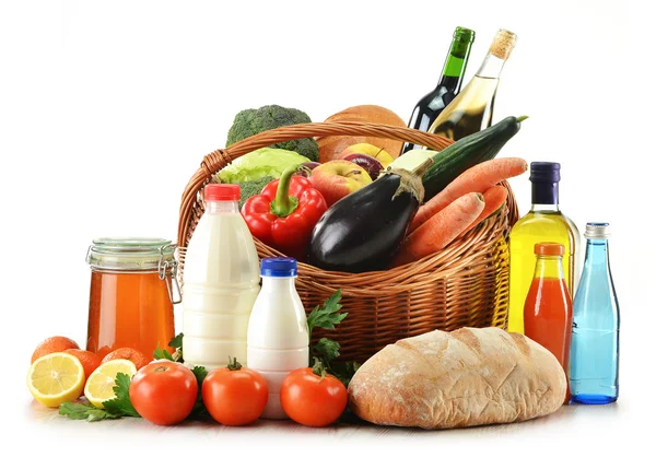 Raw food including vegetables, fruits, bread and wine Stock Photo