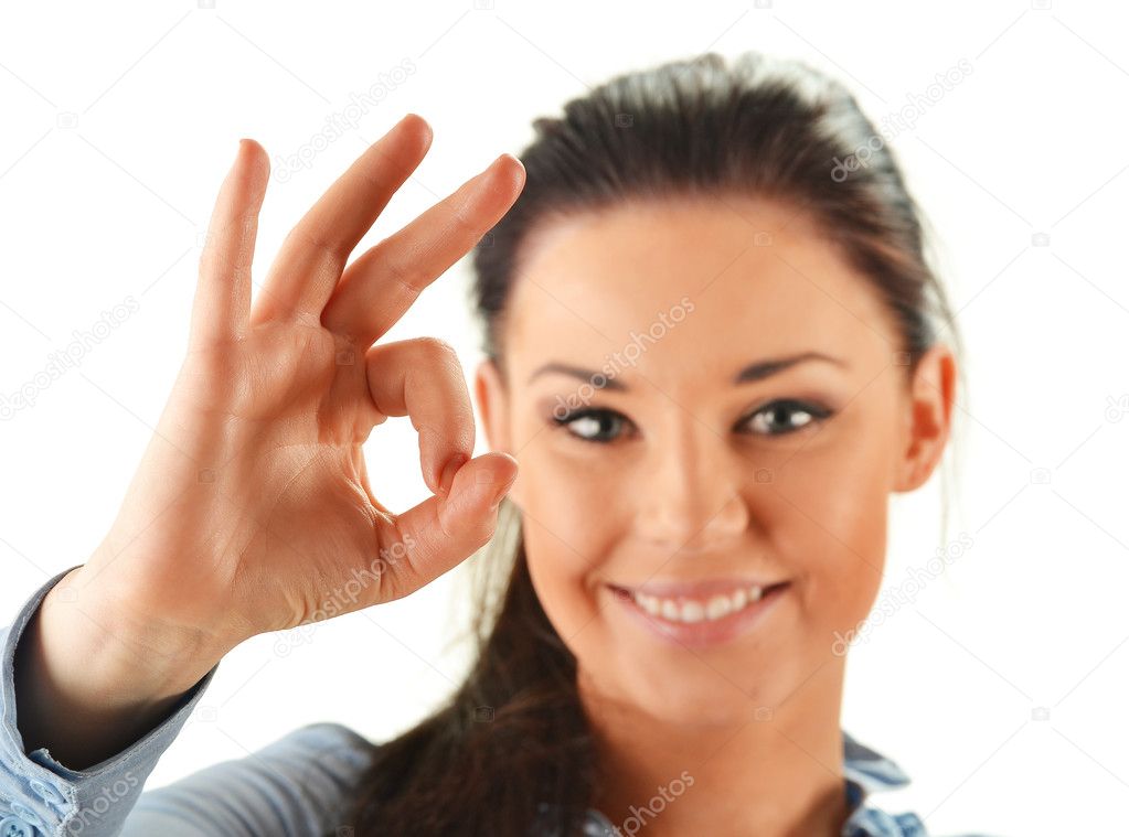 Young attractive woman showing ok isoleated on white