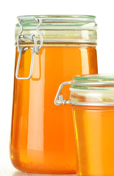 Frascos de miel aislados en blanco —  Fotos de Stock
