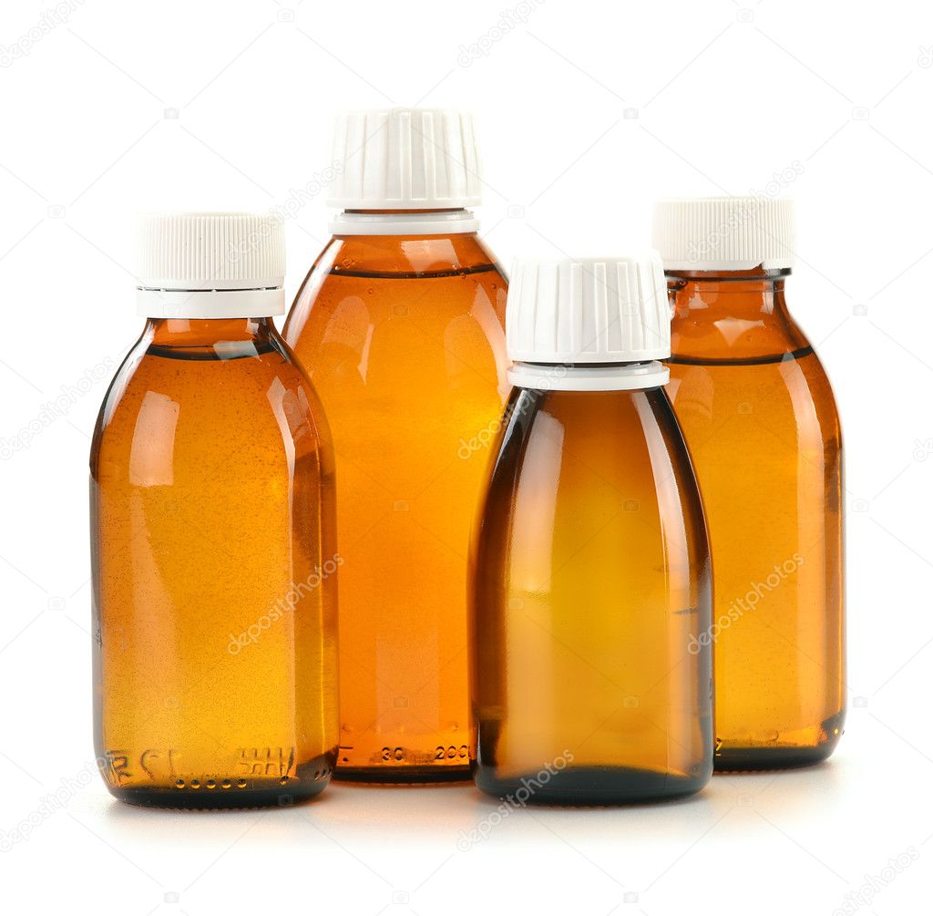 Bottles of syrup medication on white background