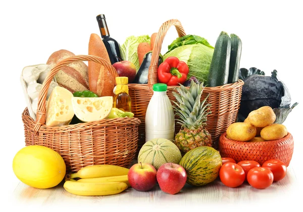 stock image Groceries in wicker basket isolated on white