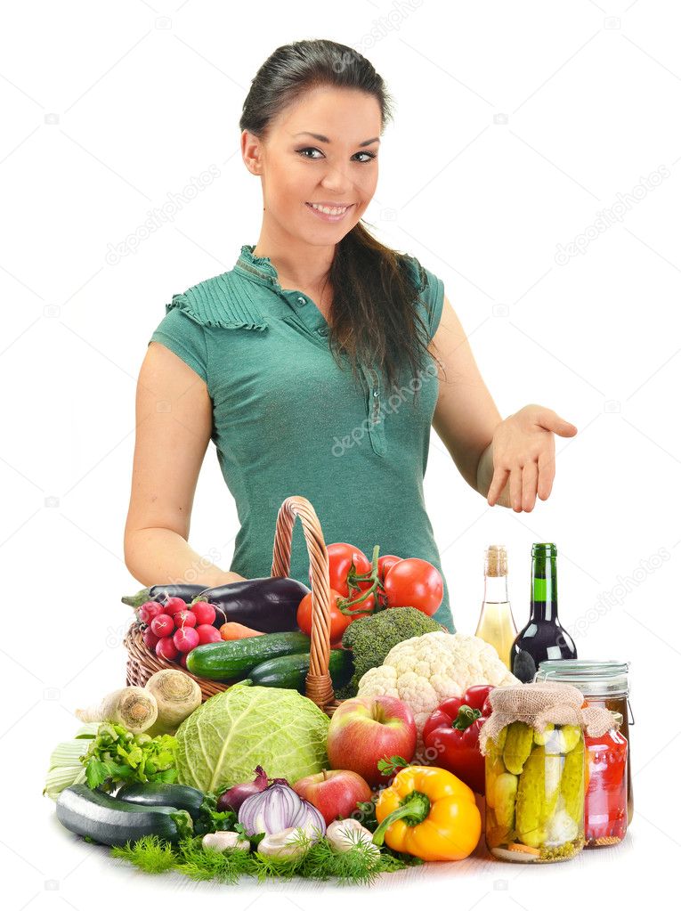 Young woman with variety of food products isolated on white