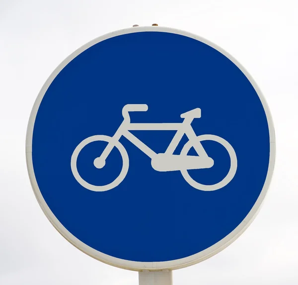 Witte fiets teken op blauwe achtergrond. — Stockfoto