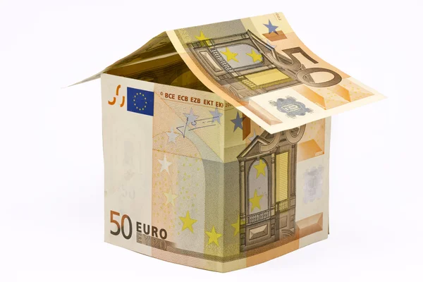 Дом из денег евро — стоковое фото