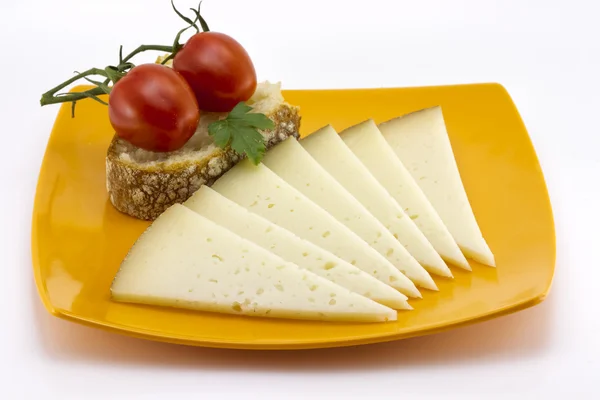 Nogle skiver manchego-ost fra Spanien - Stock-foto