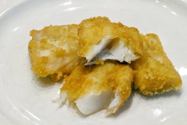 Fried salted codfish ready for a meal clipart