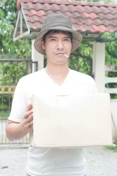 Asian man carry a box — Stock Photo, Image