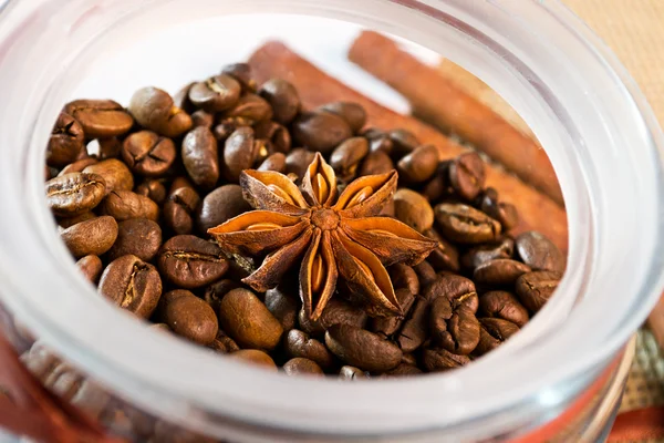 Tub is in an open glass jar with coffee beans — Stock Photo, Image