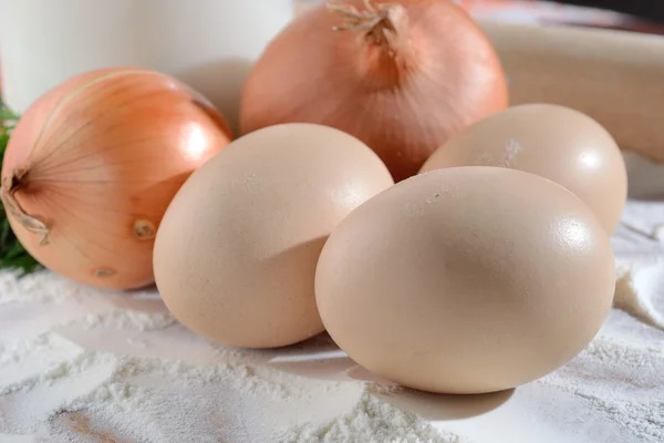 Eggs on the agony with onions and milk — Stock Photo, Image
