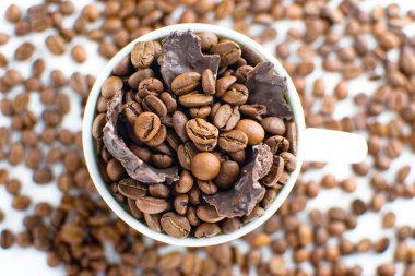 White cup with coffee beans clipart