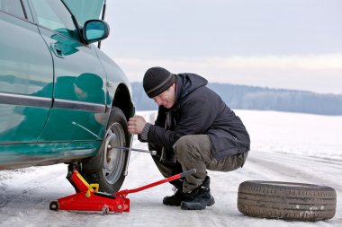 Man driver repairing car at the road clipart