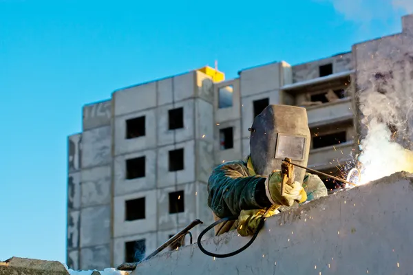 Industrial worker during welding works in construction — Stockfoto