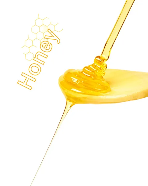 Colher de madeira com mel fluente — Fotografia de Stock