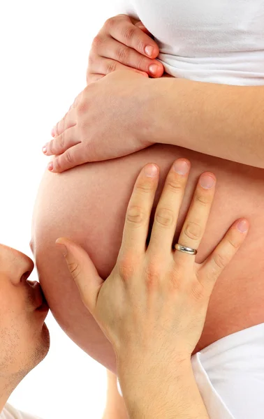 Afbeelding van gelukkig man zoenen zwangere buik van zijn vrouw — Stockfoto