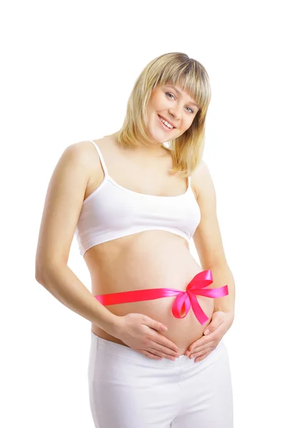 Pregnant woman with pink ribbon on her belly — Stock Photo, Image