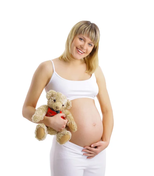 Pregnant woman with toy isolated on white — Stock Photo, Image