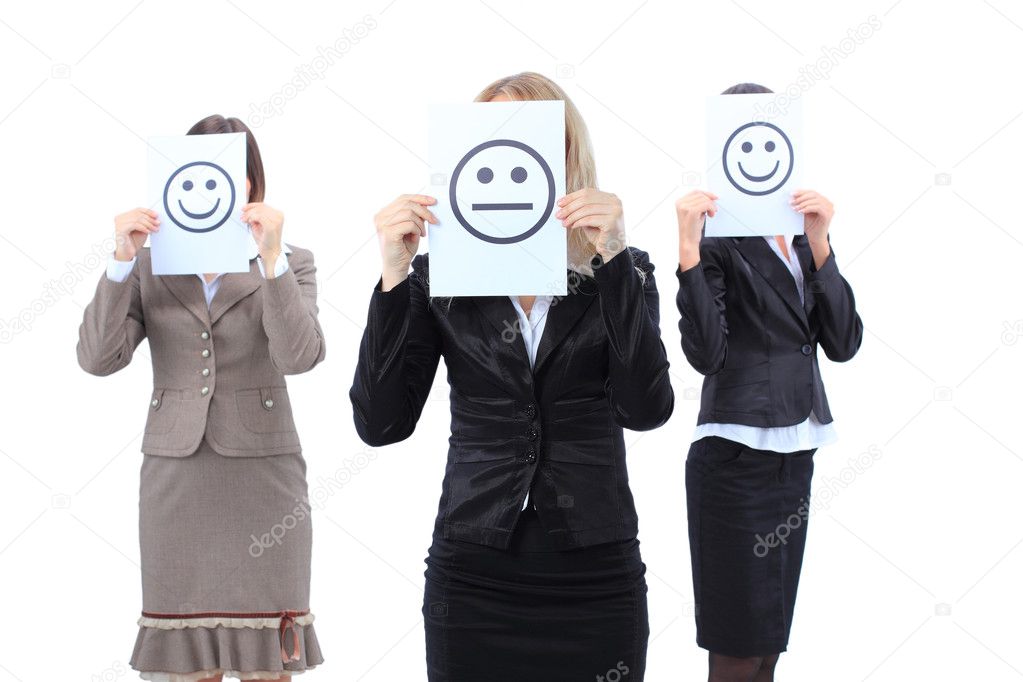 A beautiful depressed young business women hiding behind a smiley face