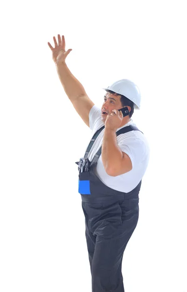 Construtor masculino gritando e falando no telefone móvel — Fotografia de Stock
