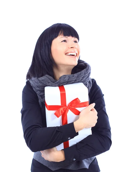 Beautiful business woman holding a gift isolated on white — Stock Photo, Image