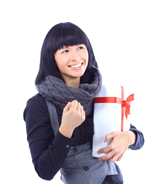 Beautiful business woman holding a gift isolated on white — Stock Photo, Image