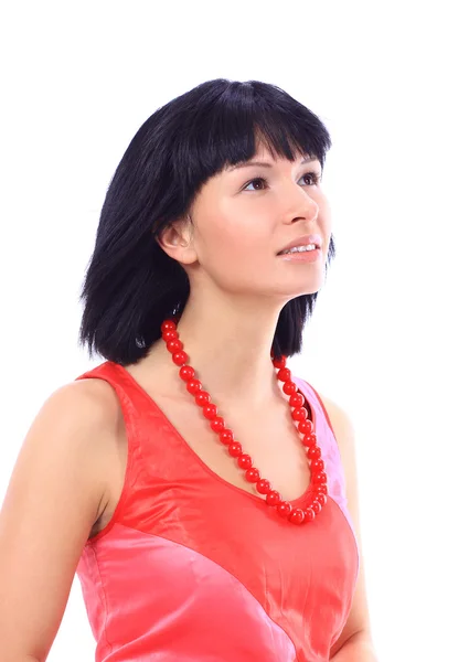 Vacker ung kvinna med röda pärlor på en vit — Stockfoto