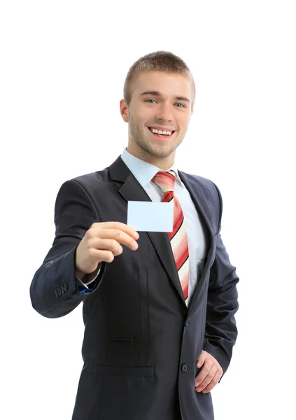 Stock image Business man handing a blank business card over white background