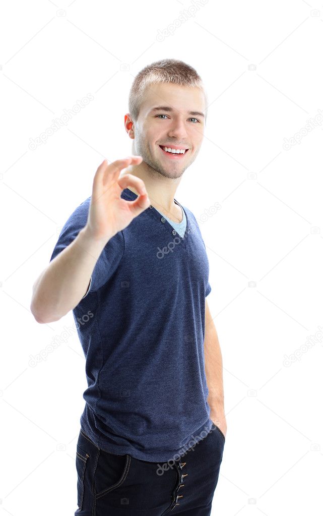 Businessman giving OK gesture isolated on white