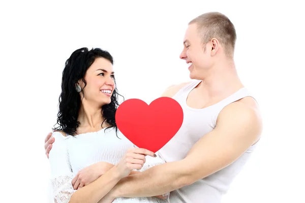 Romantique jeune couple avec symbole de coeur — Photo