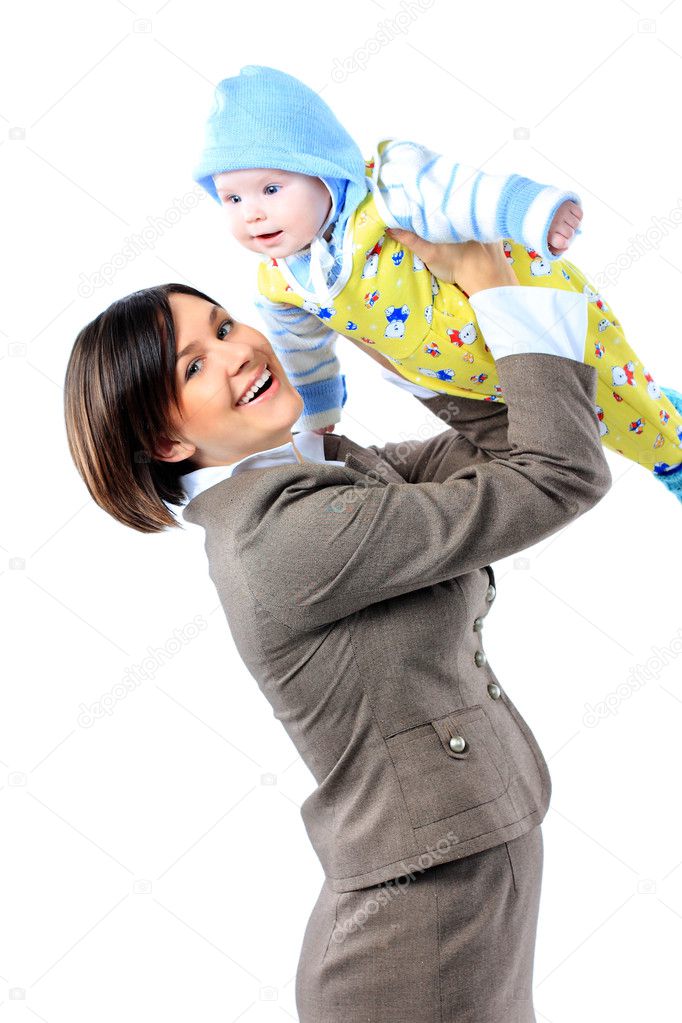 Business woman in suit carrying baby in arms.