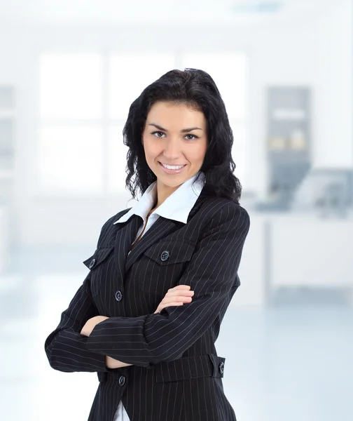 Young brunette business woman in her office — Stock Photo, Image