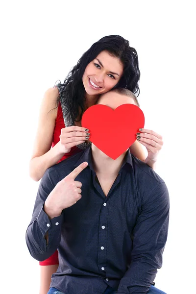 Woman hides her face behind a guy with a big red heart — Stock Photo, Image