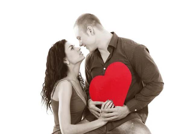 A shot of a man and a woman in love in black and white with red heart — Stock Photo, Image