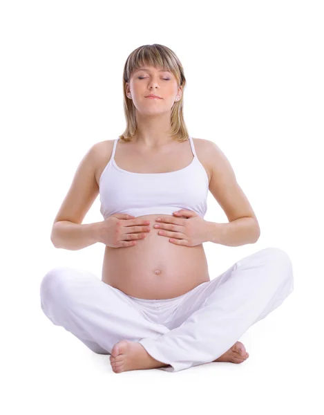Hermosa mujer embarazada tocando su hermoso vientre - aislado — Foto de Stock