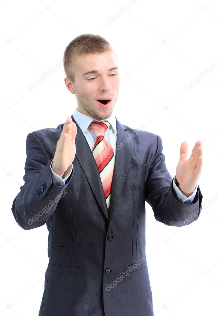 Portrait of a business man bragging about the size of something with hand over white background