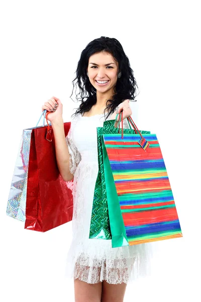 Glücklich einkaufende Frau hält Taschen isoliert auf weiß — Stockfoto