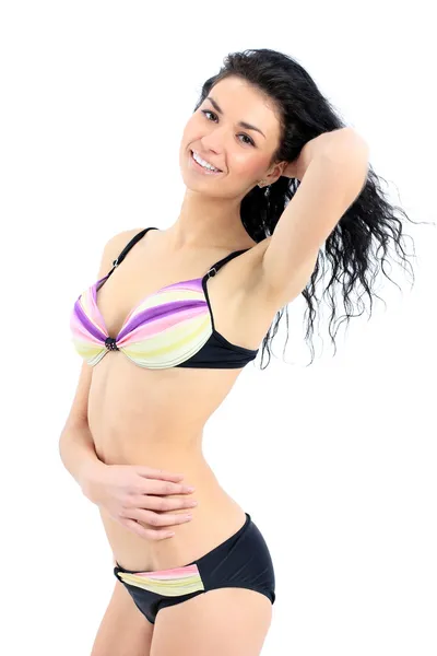 Brünette attraktive Frau im Badeanzug auf weißem Hintergrund — Stockfoto