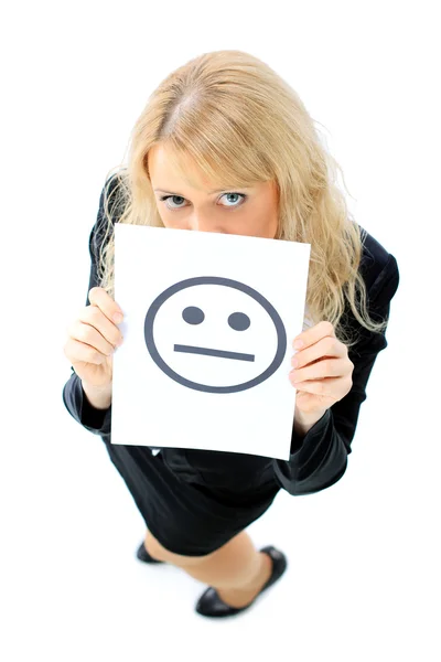 A beautiful young business woman hiding behind a smiley face — Stock Photo, Image