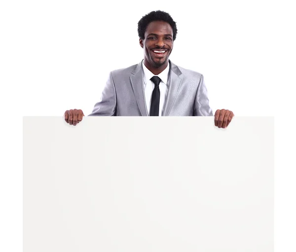 Черный бизнесмен с изолированной панелью — стоковое фото