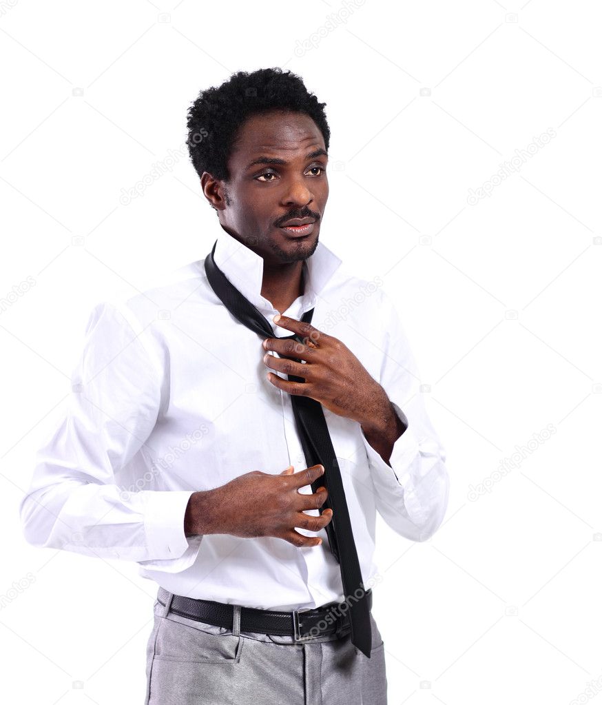 Close up portrait of african businessman tying black tie