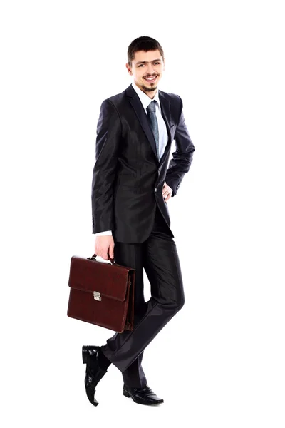 Business man holding briefcase in hand isolated on white — Stock Photo, Image