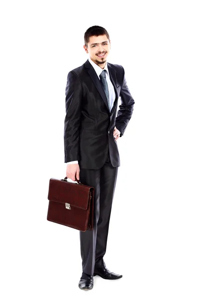 Portret van een jonge succesvolle zakenman uitvoering van een koffer op witte pagina — Stockfoto
