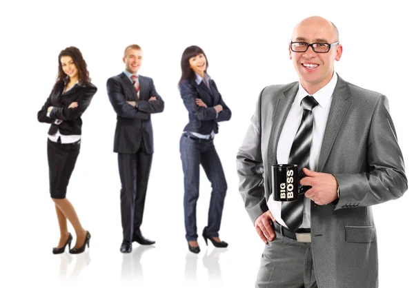 Business man with cup of tea with a groupbusinesspeople behind him — Stock Photo, Image