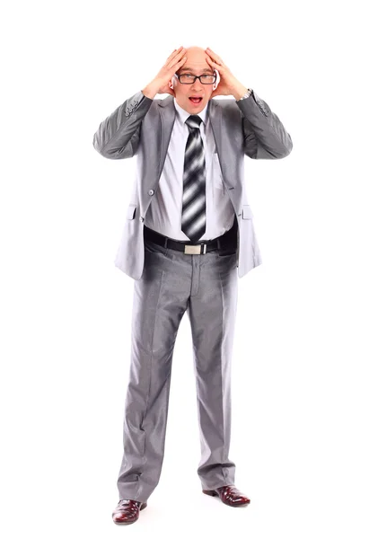 Uomo d'affari sorpresa tenere mano sulla testa, indossare abito elegante — Foto Stock